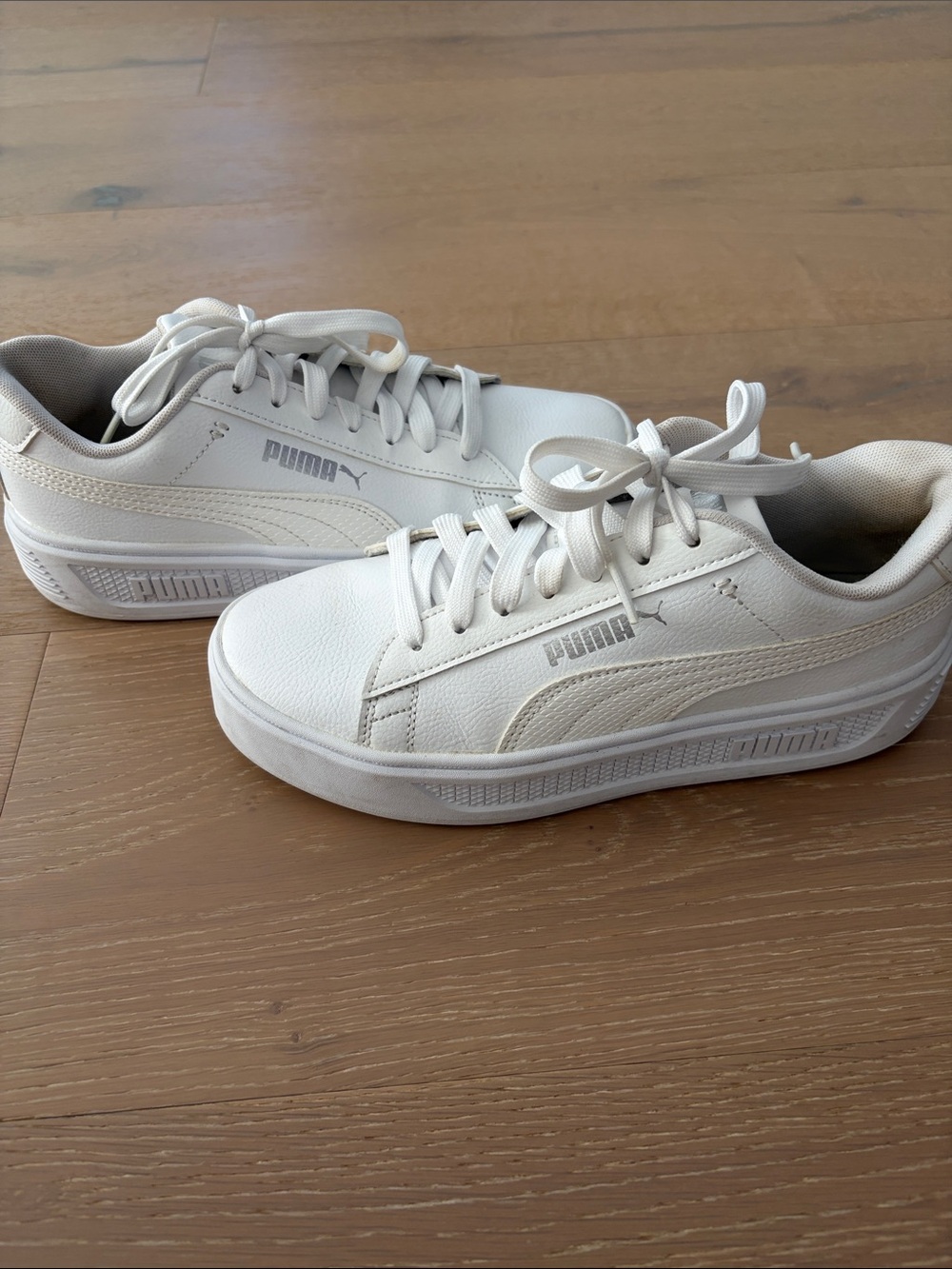Puma Women’s White Platform Sneakers. Inside has some wear but can be washed.